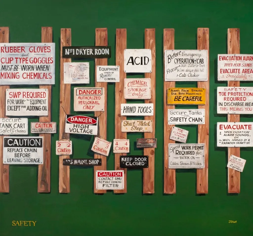 painting of lettered signs on vertical boards