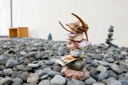 A rock cairn stands as part of “Mignon Votives — Pebble Parades” by Haegue Yang at the...