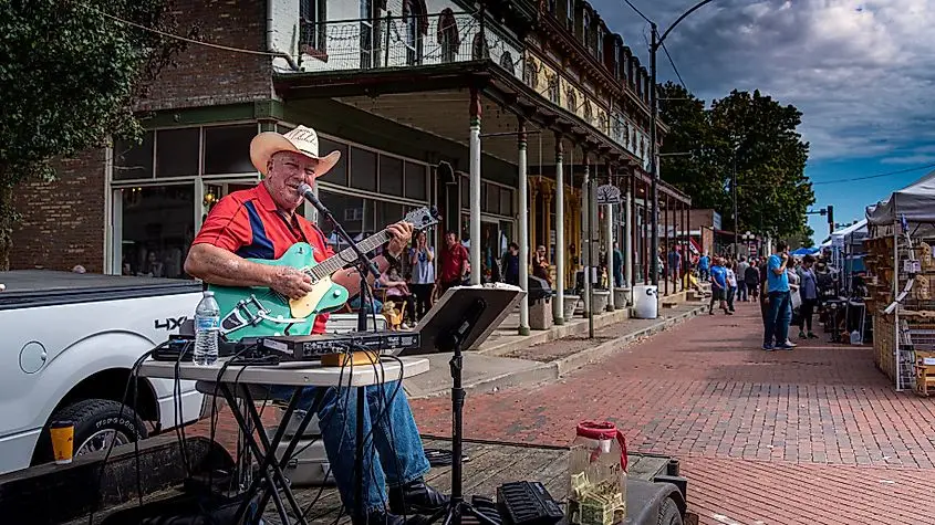 A country folk singer performing during the fall festival in Lebanon, Illinois