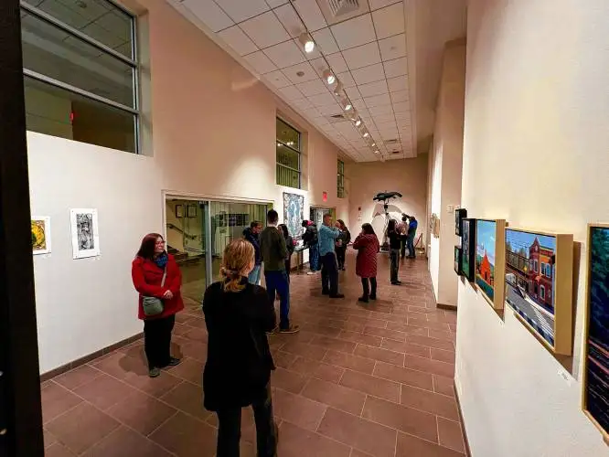 Friends, family and students peruse art on display during the opening reception of the annual Northfield Mount Hermon faculty art exhibit.