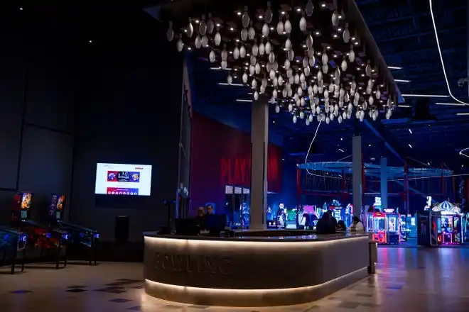 A bowling pin chandelier hangs by the entrance of Gamescape, El Paso’s new all-ages entertainment spot by Cinemark, as seen on Friday, Feb. 21, 2025.