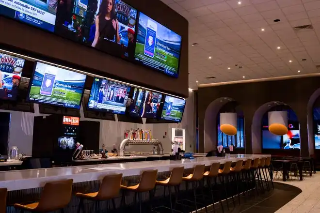 Gamescape, El Paso’s new all-ages entertainment spot by Cinemark, features a bar with several TVs around it, as seen on Friday, Feb. 21, 2025.