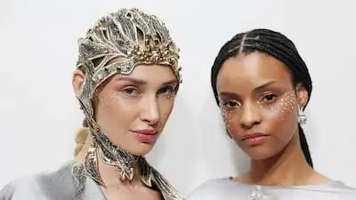 Models wearing sparkling crystals on their faces for Maison Sara Chraibi's collection, The Heavens, at London Fashion Week. Getty Images