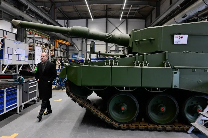 German Chancellor Olaf Scholz visits weapons maker Rheinmetall in Unterluess, Germany on Feb. 12, 2024.