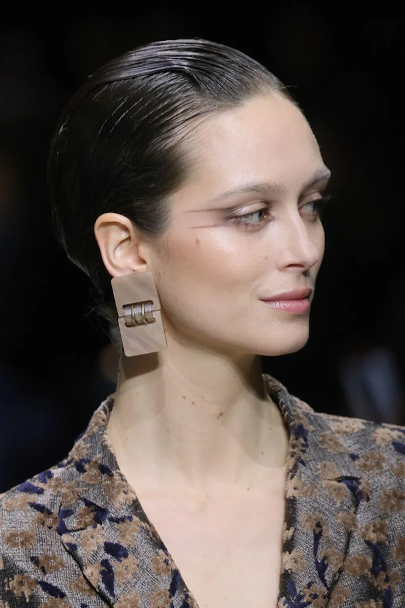 A model, fashion detail, walks the runway at the Giorgio Armani fashion show during the Milan Fashio...