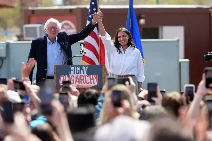 Sen. Bernie Sanders, I-Vermont, and Rep. Alexandria Ocasio-Cortez, D-N.Y., greet the crowd duri ...