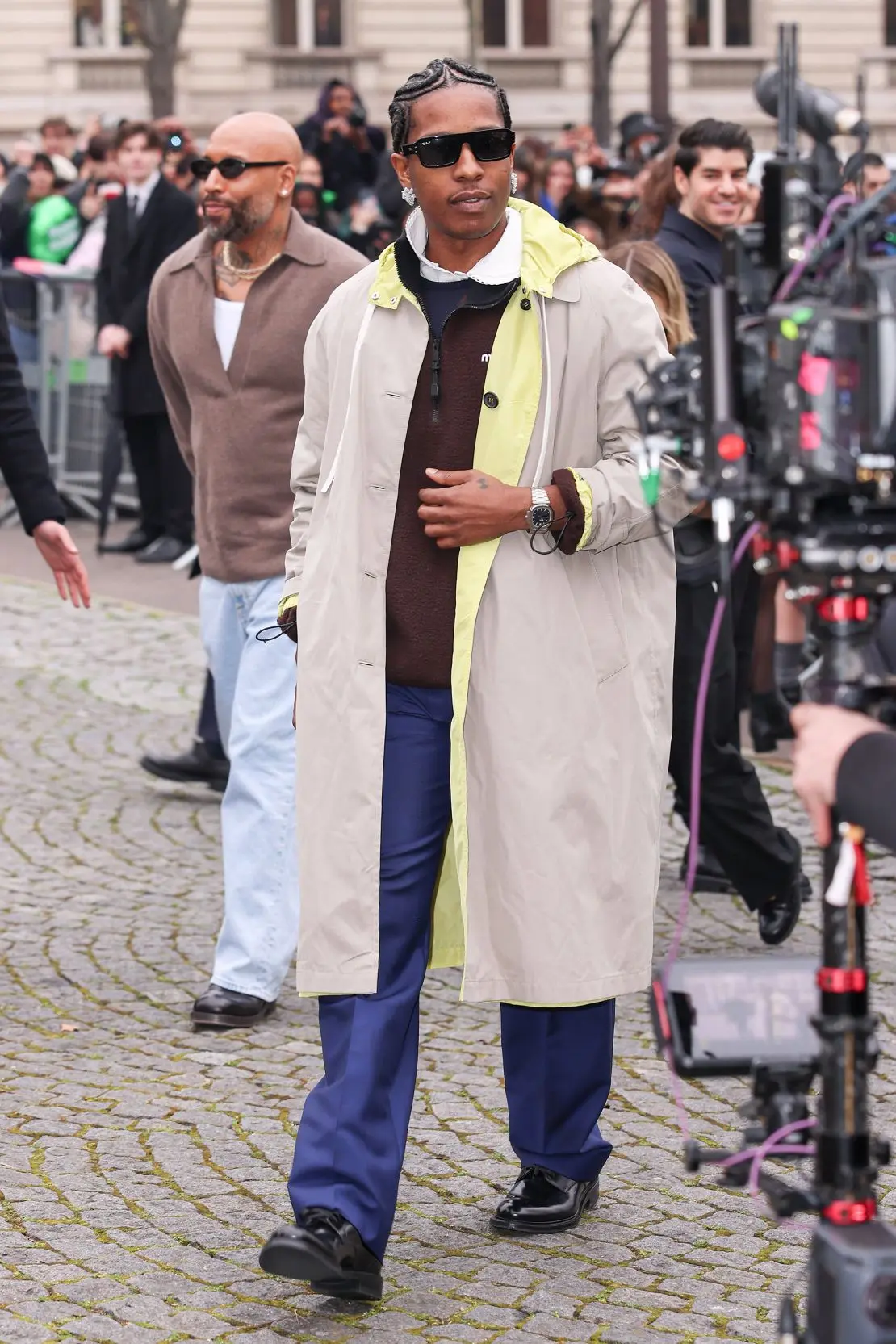 Wearing a khaki Miu Miu raincoat, Rapper A$AP Rocky brought star power to the brand’s front row.