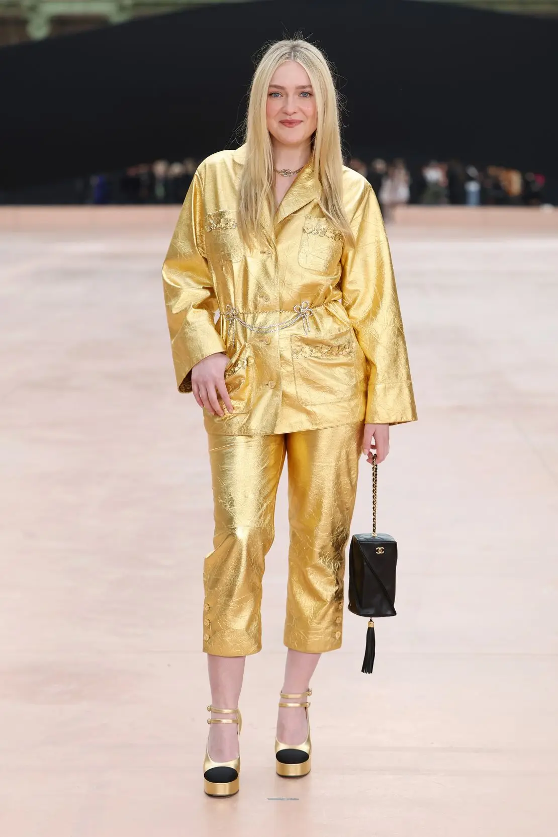 Actor Dakota Fanning went for gold at Chanel.