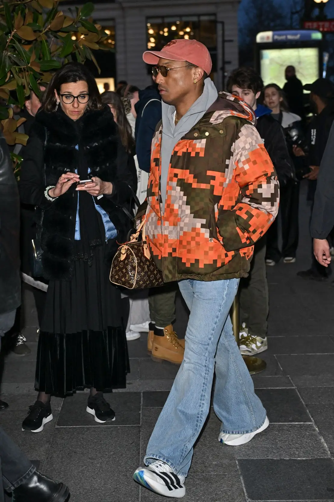 Pharrell Williams, musician and men’s designer for Louis Vuitton, wears a jacket covered in the French brand’s signature “Damoflage” print.