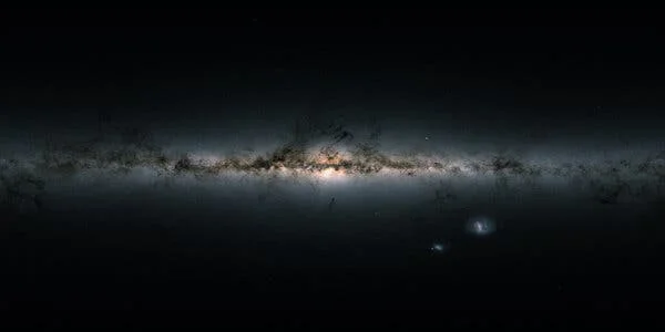 Light emanates from a far-off view of the Milky Way.