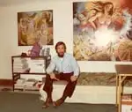 Artist Le Quang Vinh sits in front of his finished paintings in his first NE Portland studio in 1975. Le's daughter Van will be showcasing his artwork in a series of events starting April 5, 2025 at the Oswego Heritage House.