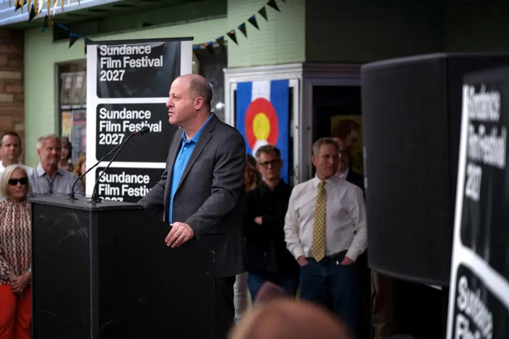 Man stands at podium