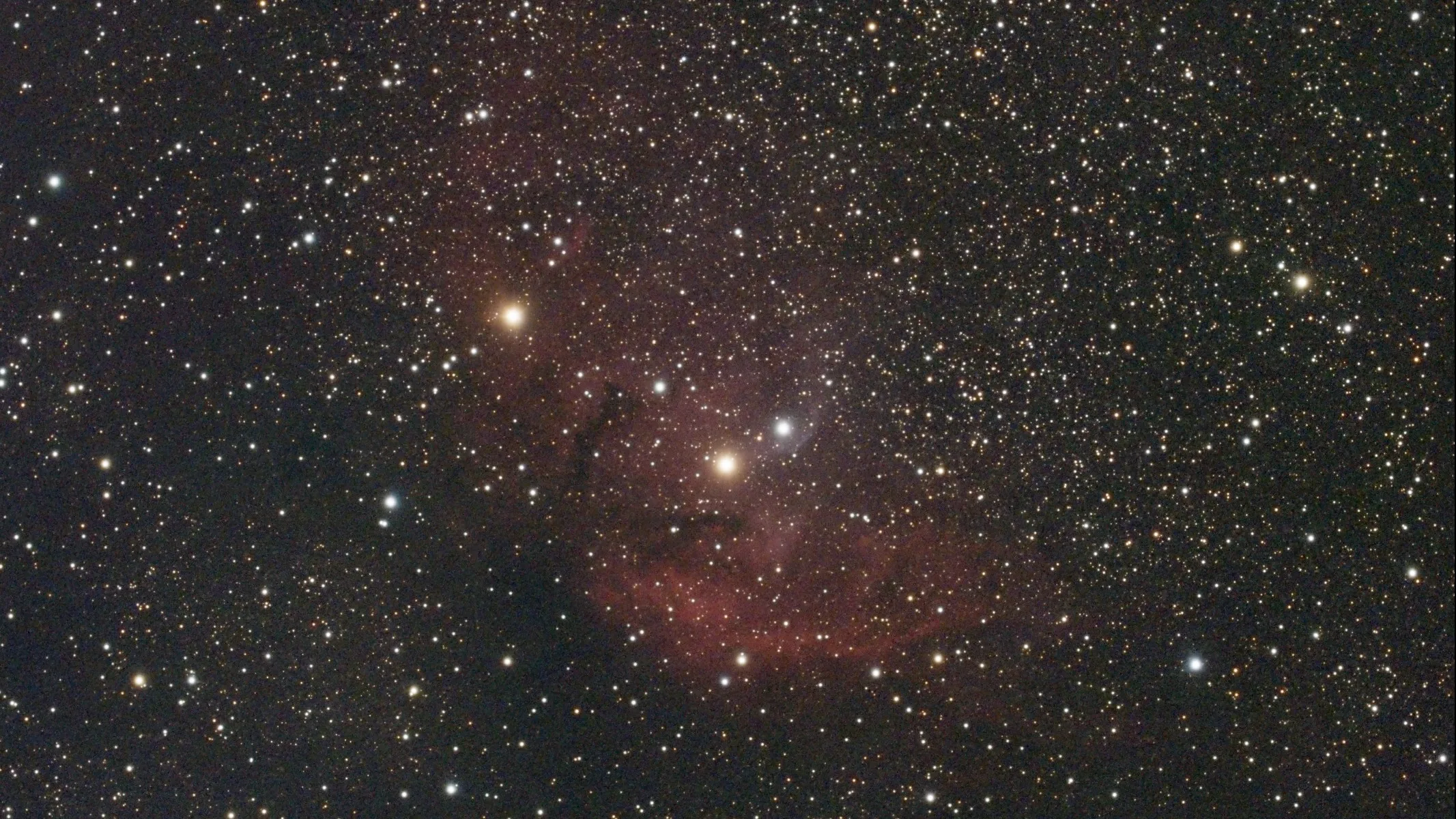 A deep space nebula, with two particularly bright stars and many other stars.