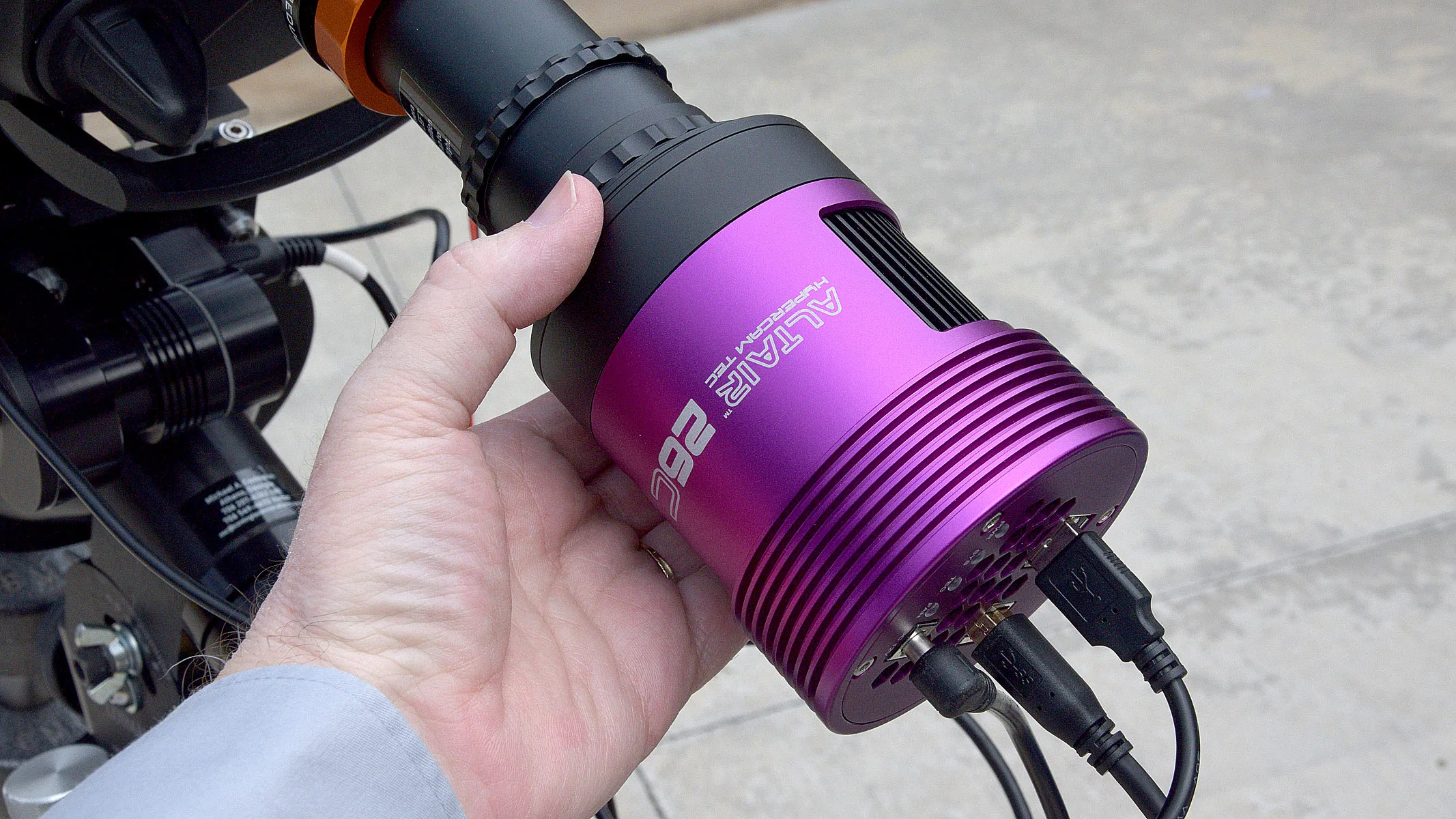 The Altair Hypercam 26C APS-C Colour TEC held in a hand.