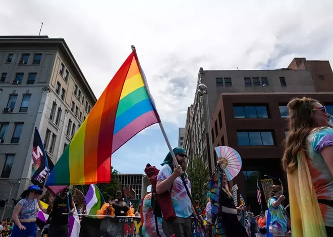 Someone carries a pride flag during the annual Spokane Pride parade.