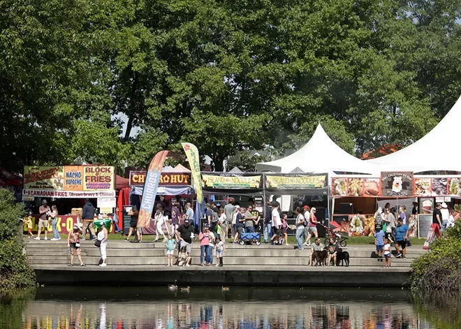 People fill Riverfront Park and stop by various food vendors at Pig Out in the Park.