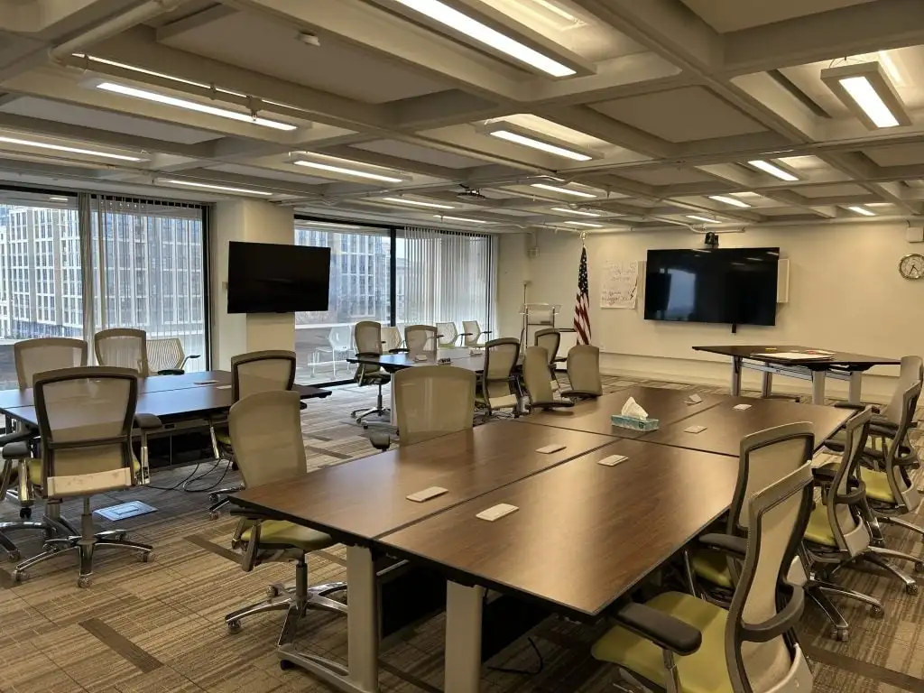 A vacant office with several desks and chairs