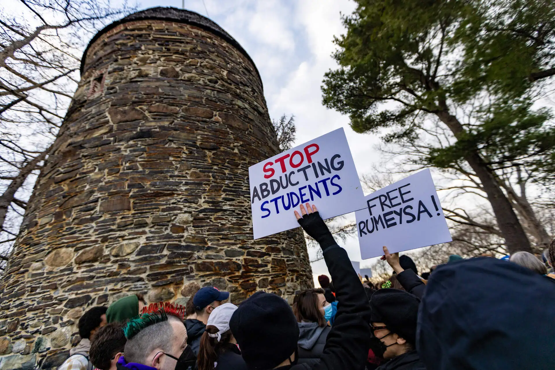 Over one thousand people filled Powder House Park in Somerville to rally for support Tufts graduate student Rumeysa Ozturk and protest her detention by ICE. (Jesse Costa/WBUR)