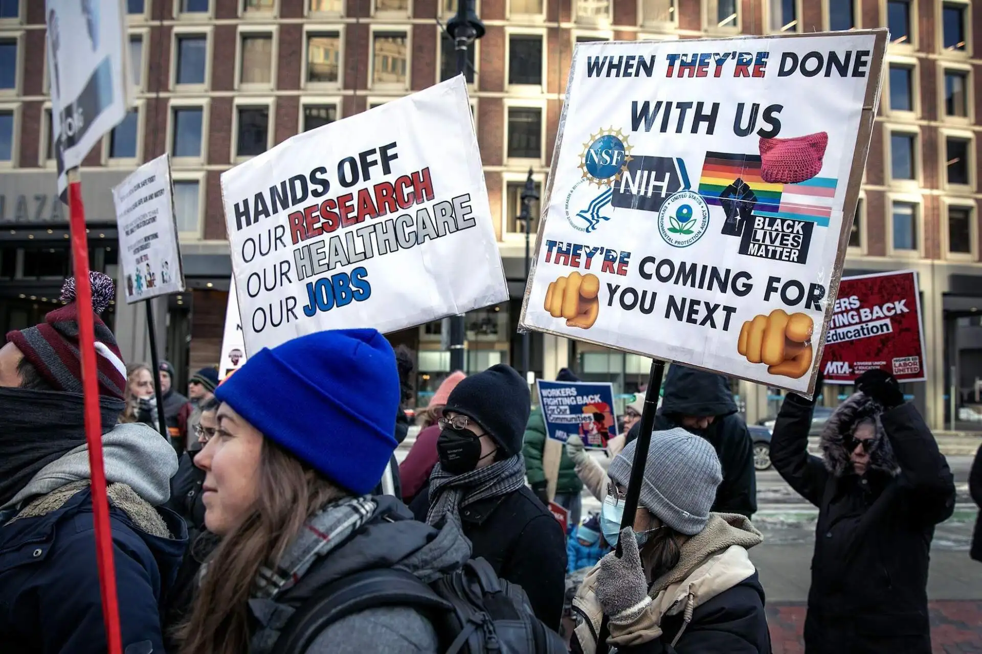 Outside the JFK Federal Building in Boston, Labor Unions protest against an effort to cut funding for scientific research. (Robin Lubbock/WBUR)