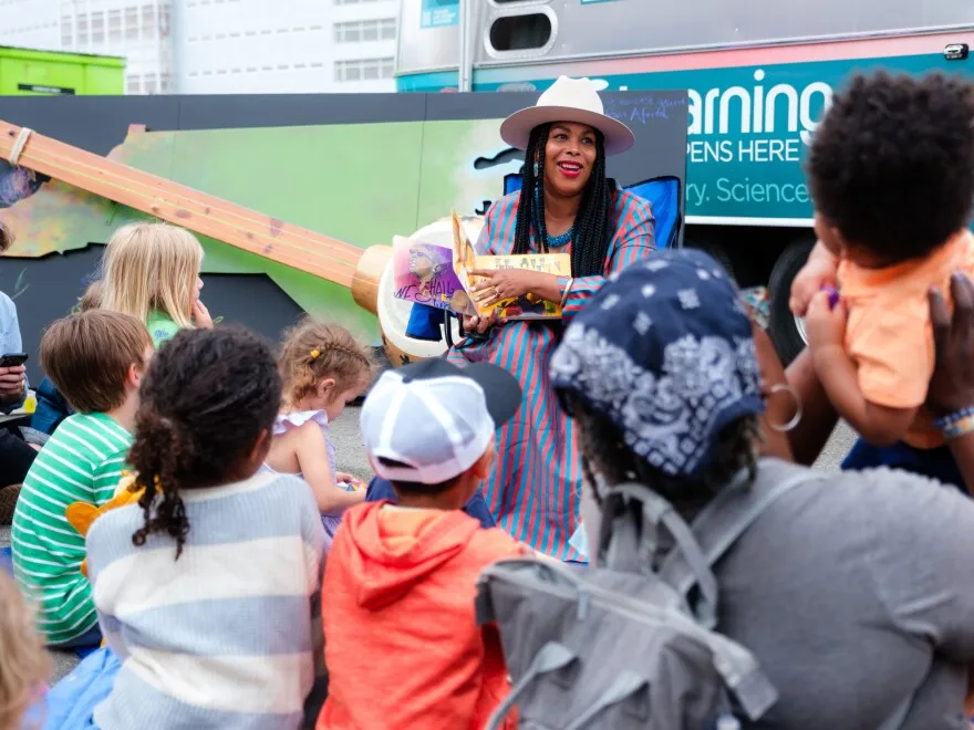Michelle Lanier, a historian, filmmaker and author, reads a book to children about North Carolina's history during the festival.