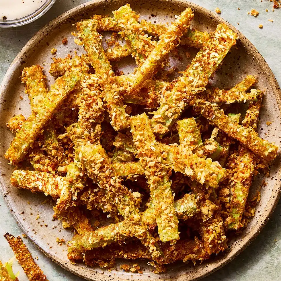 Crispy Parmesan Broccoli Stem Fries crispy parmesan broccoli stem fries on a plate