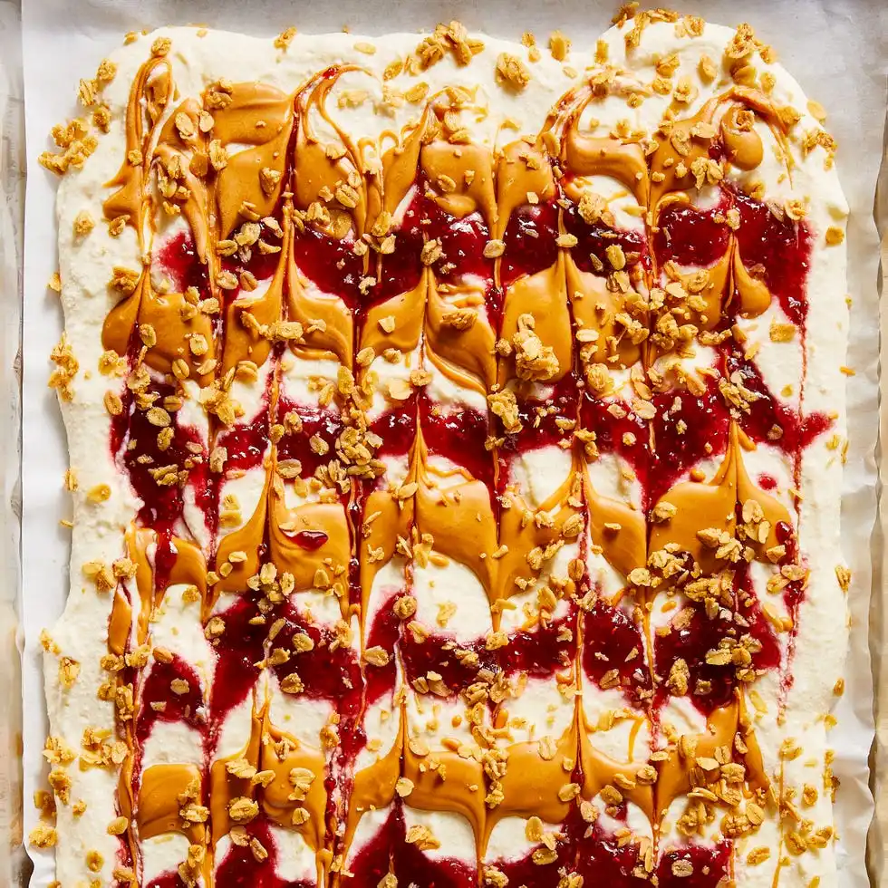 Cottage Cheese Bark cottage cheese with peanut butter, raspberry jam, and granola