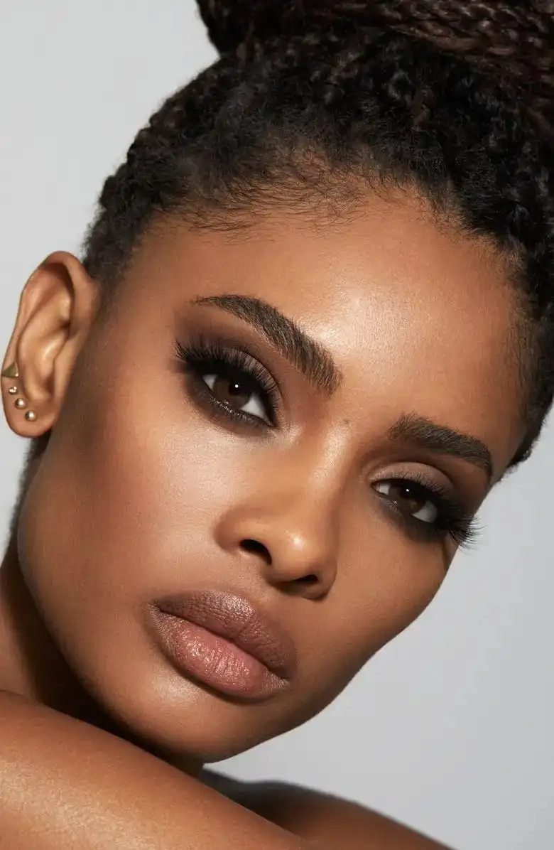 black woman wispy lashes 2000 makeup trends