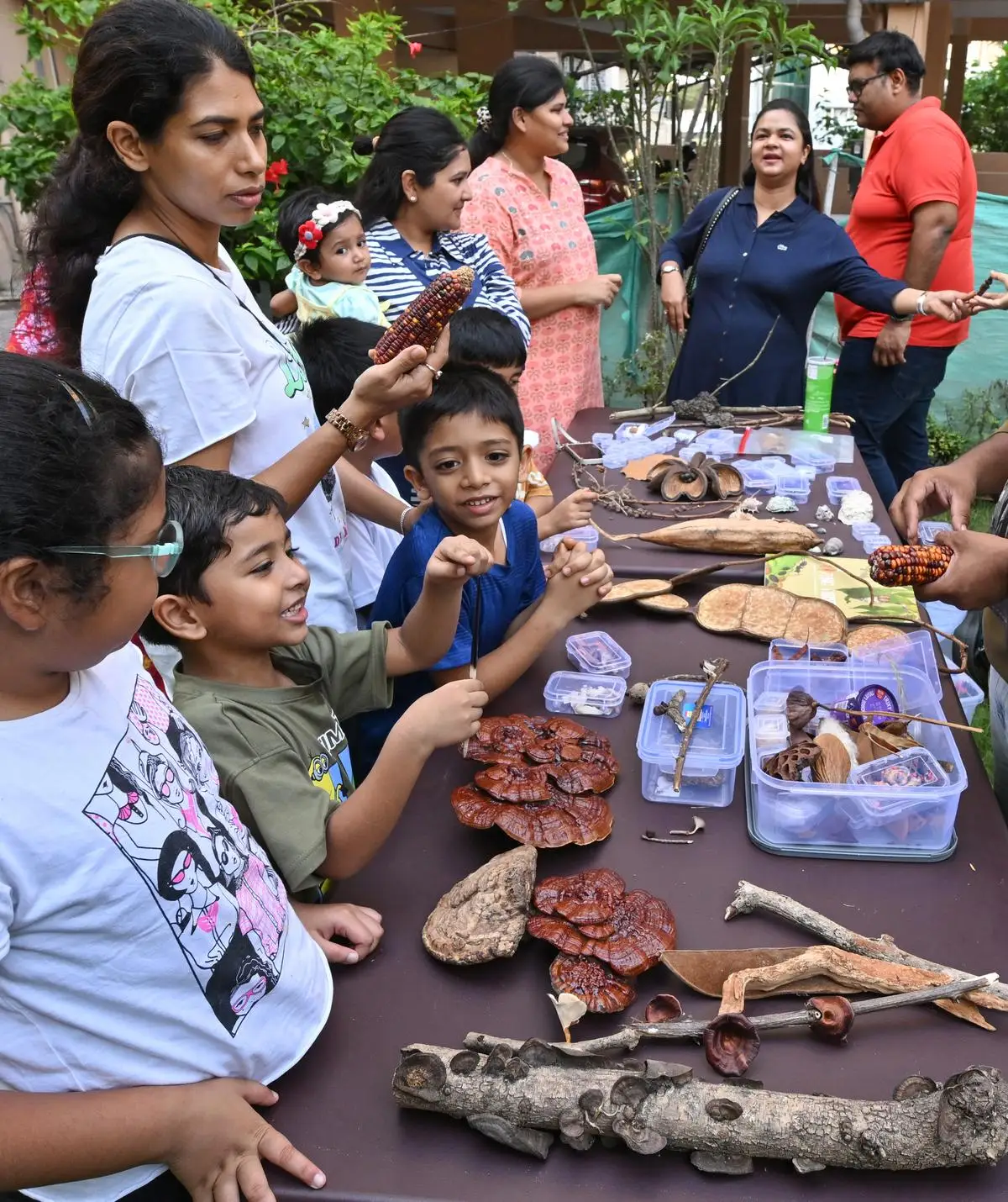 Participants experiencing the portable natural history museum by Wilded, a Nature education group, at a residential society in Visakhapatnam. Hindu