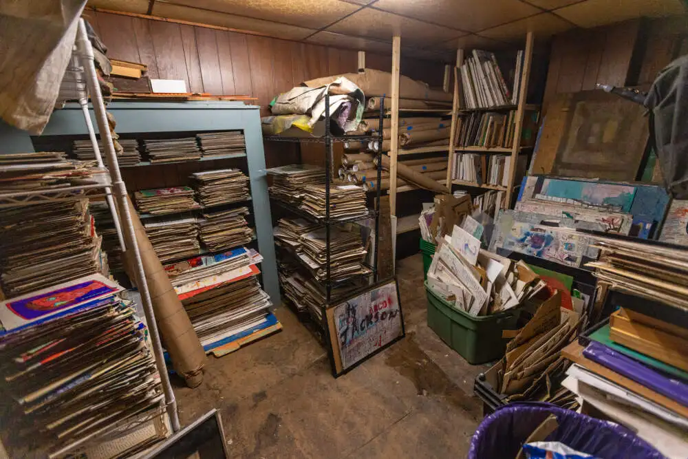 Thousands of works by Jon Sarkin in storage in the back of his former studio in Gloucester. (Jesse Costa/WBUR)