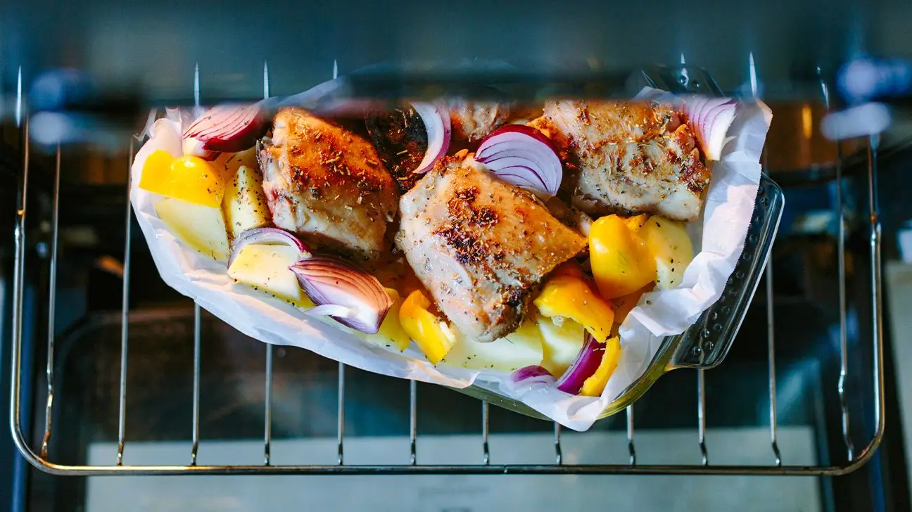 Roasted chicken with potatoes, red onions