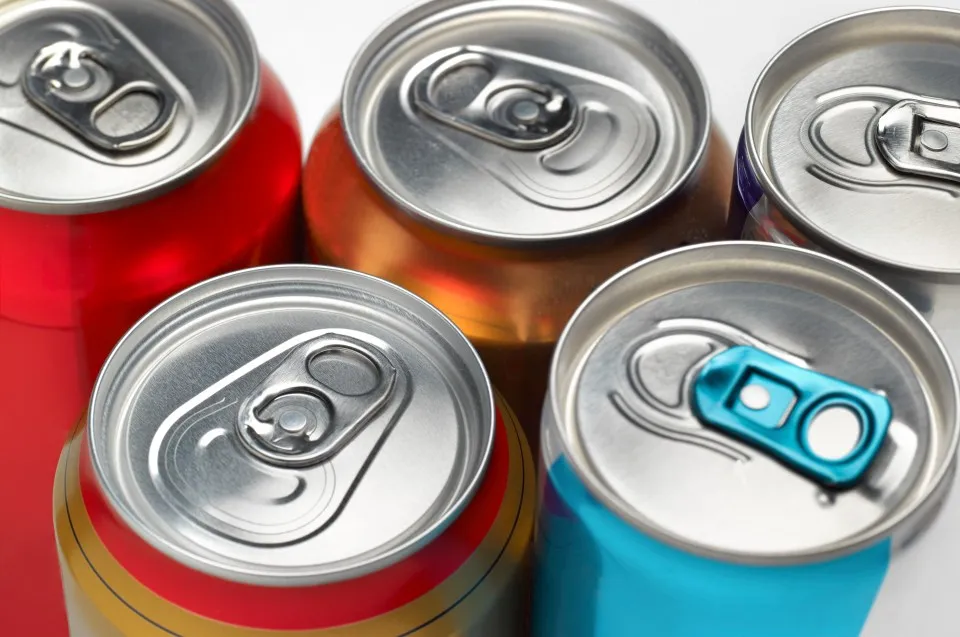 Close-up of several soda cans.