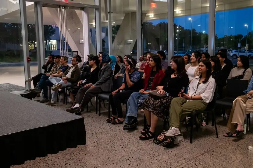 Inside the Crow Museum at UTD, an audience watches a screening of three short films by AAPI...
