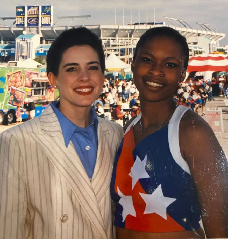 American All-Star Cotrenia Hood pictured with first hearing impaired Miss America, Heather Whitestone, at Super Bowl 33. 