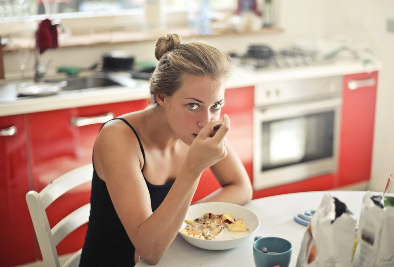 woman eats oatmeal
