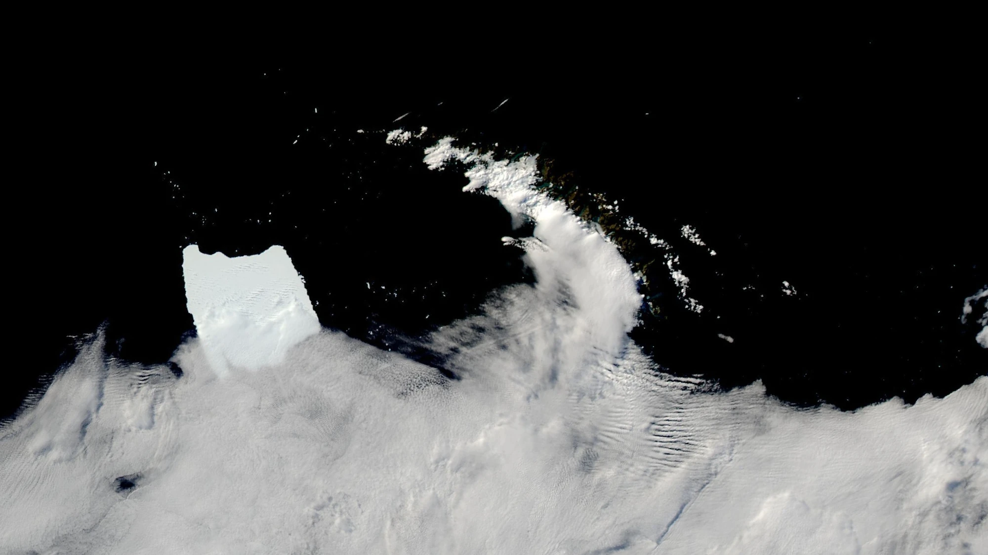 Antarctic iceberg A-23A stuck in shallow waters off the coast of South Georgia island in the South Atlantic Ocean on March 4, 2025, as seen by the MODIS instrument on NASA's Aqua satellite.