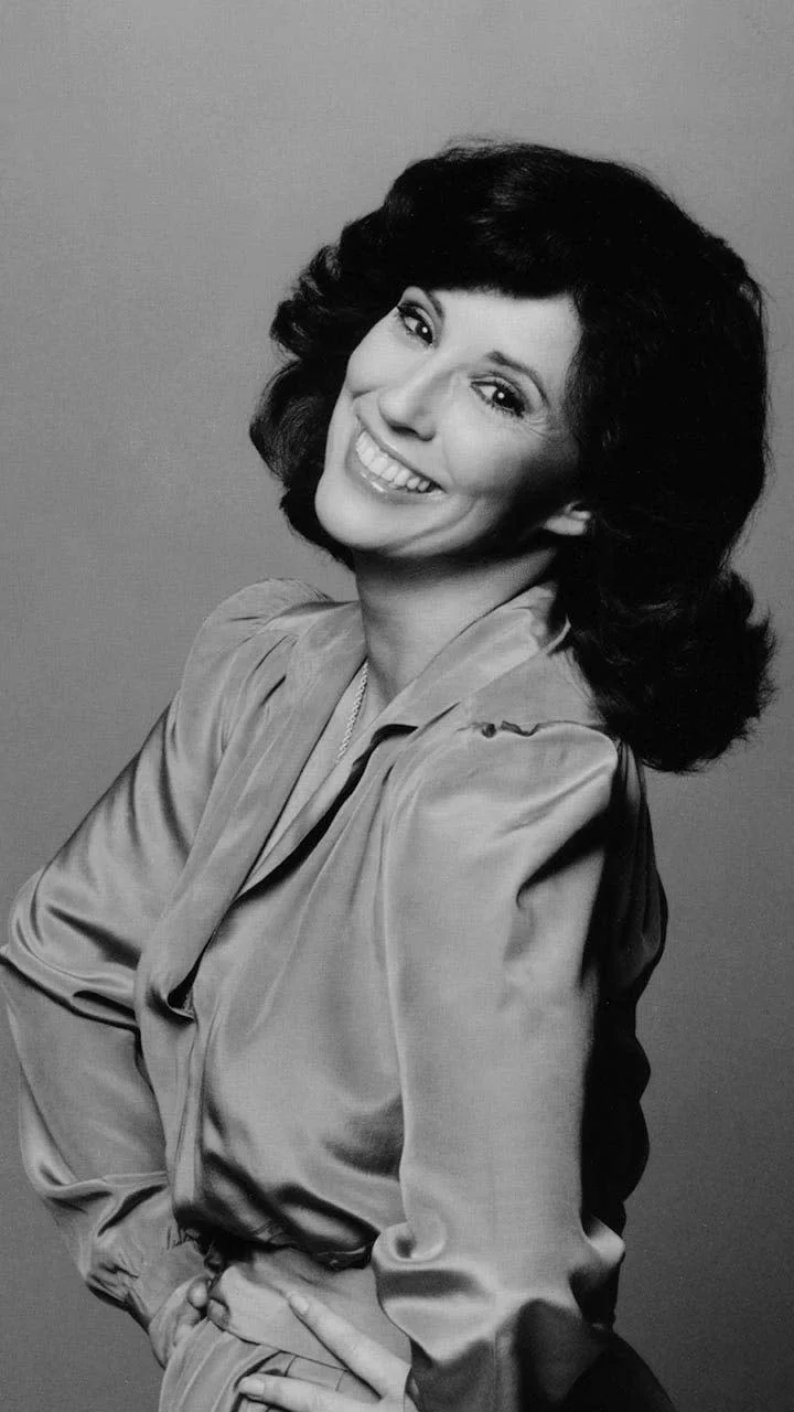 Denise Alexander smiling in a glamor shot