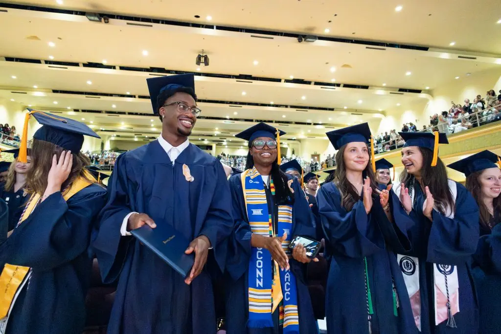 Graduates in their caps and gowns during their ceremony
