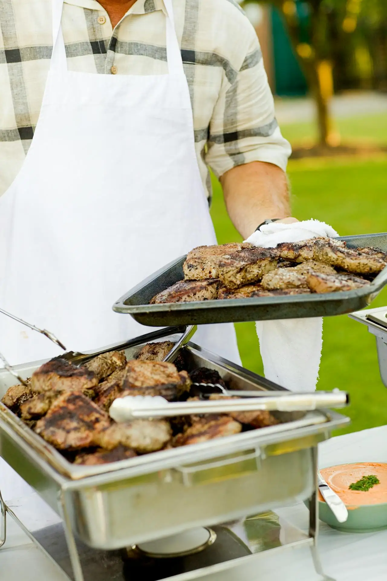 man with barbecued meat