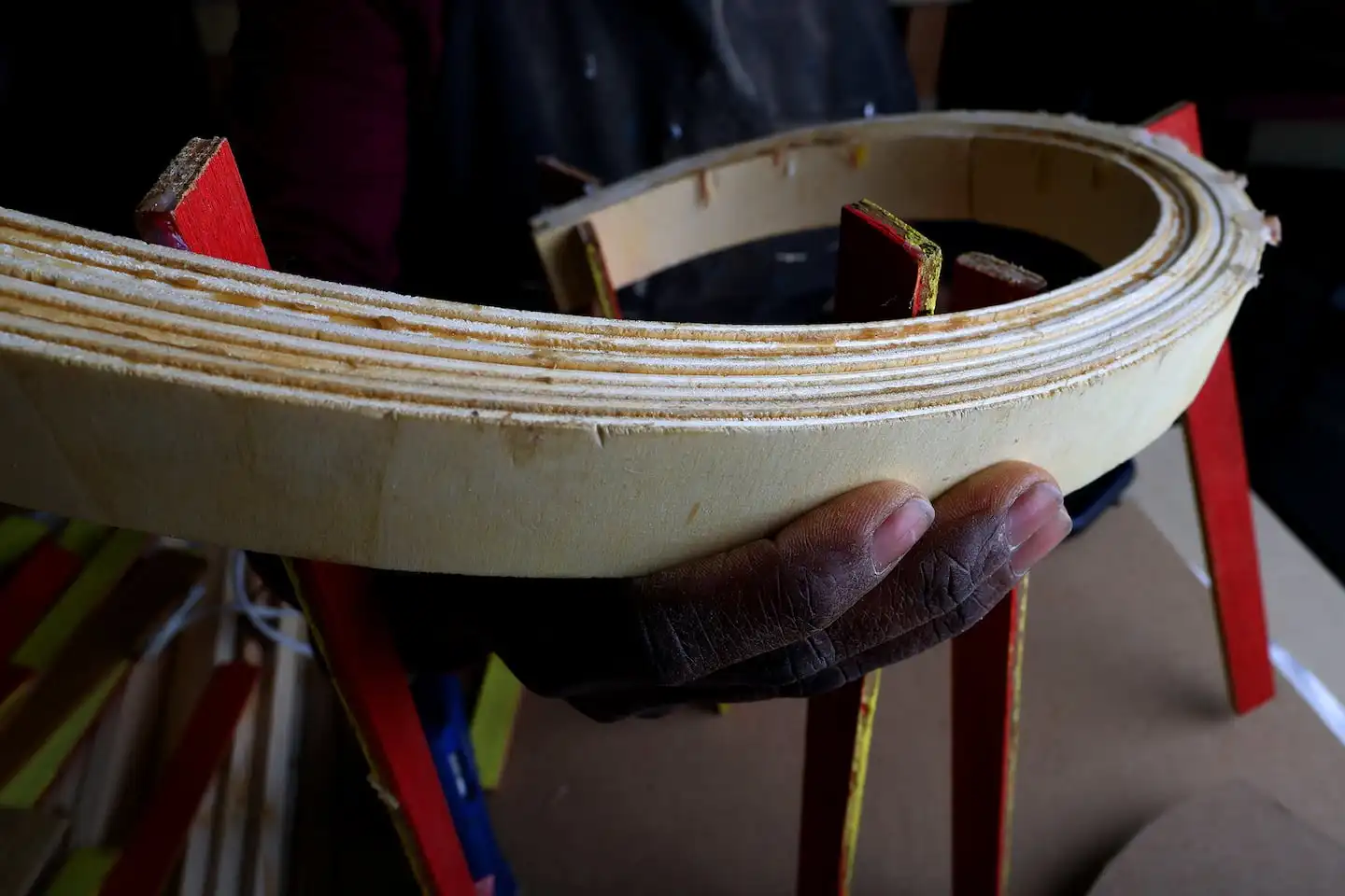 Alison Croney Moses shapes laminated wood for a scale model of her Triennial installation in her Allston studio. (Lane Turner/Globe Staff) 