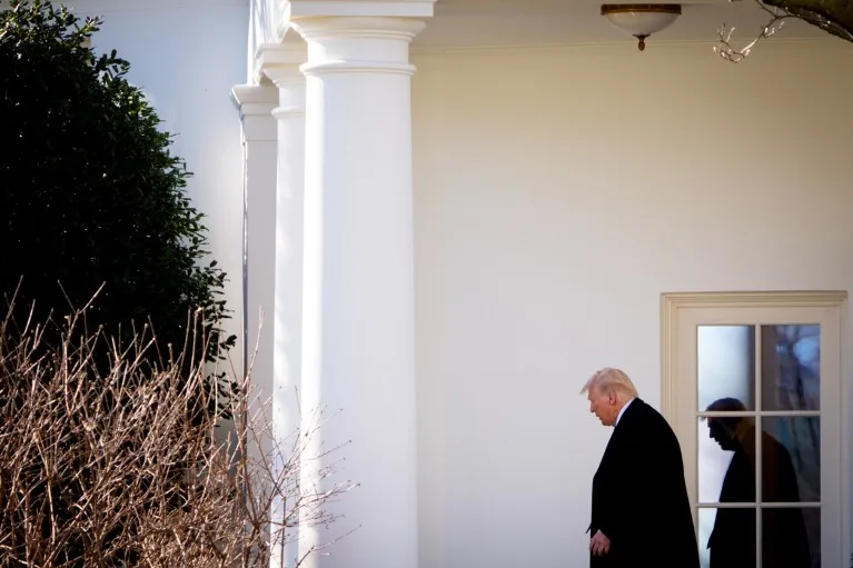 Donald Trump walks outside of the Oval Office