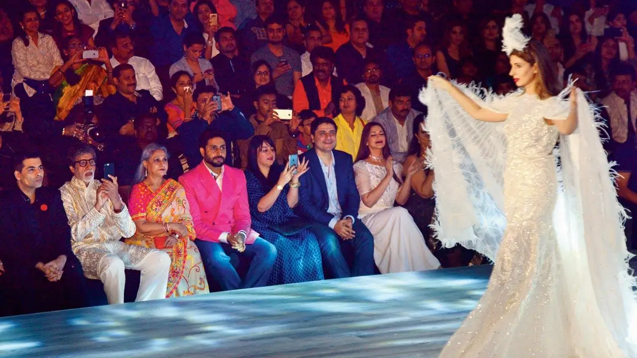 Karan Johar, Amitabh Bachchan, wife Jaya, son Abhishek, Shrishti Behl, Goldie Behl, Sonali Bendre seated in the front row at a show by Abu Jani and Sandeep Khosla in 2016. File pic/Satej Shinde