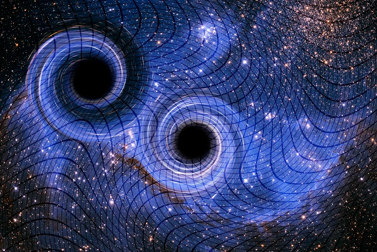 Artist's impression of gravitational waves being generated by interactions between two black holes. Credit: Victor De Schwanberge / Science Photo library / Getty Images