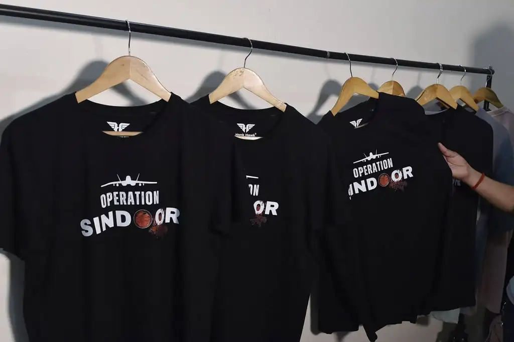 T-shirts featuring “Operation Sindoor” on display at a store in Ludhiana, India. Businesses have cashed in on the recent flare-up in the India-Pakistan conflict, offering military operation-themed T-shirts and tote bags. Photo: AFP