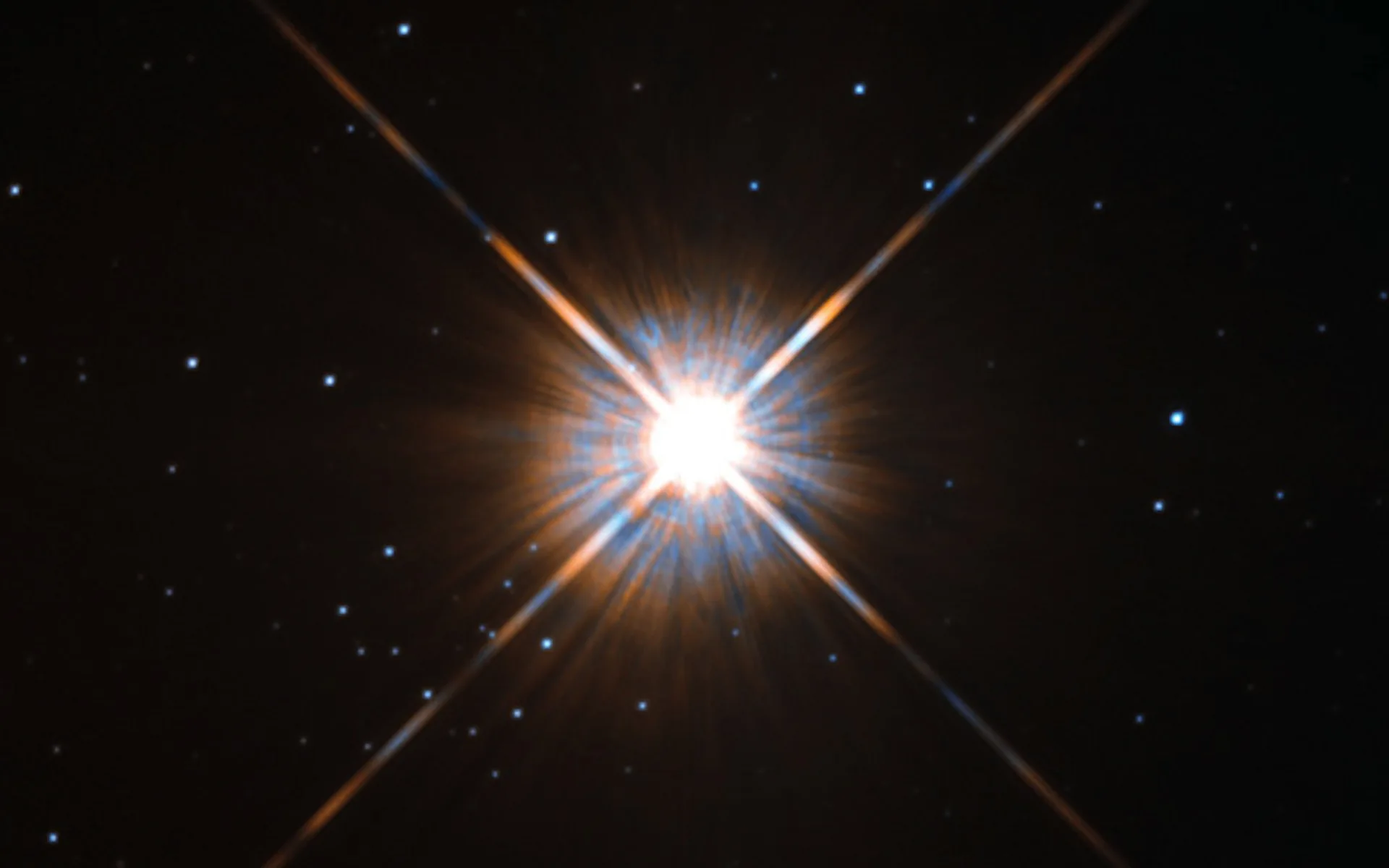 a bright four-pointed star on a black background