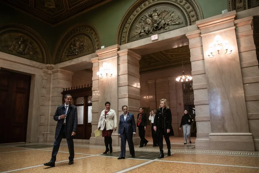 Chicago Mayor Lori Lightfoot walks with her staff, Chicago Department of Cultural and Affairs and Special Events Commissioner Erin Harkey, in beige, and First Lady Amy Eshleman around the newly renovated Grand Army of the Republic (G.A.R.) Memorial Hall and Rotunda at the Chicago Cultural Center during a media opening of the space, Friday morning, March 25, 2022