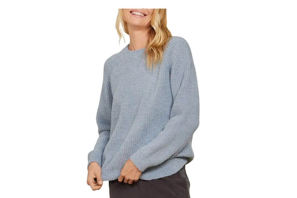 a model in a sweater