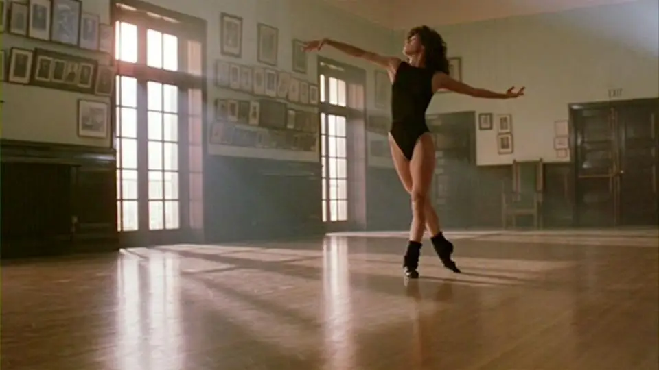 Jennifer Beals dancing in leg warmers in a scene from Flashdance