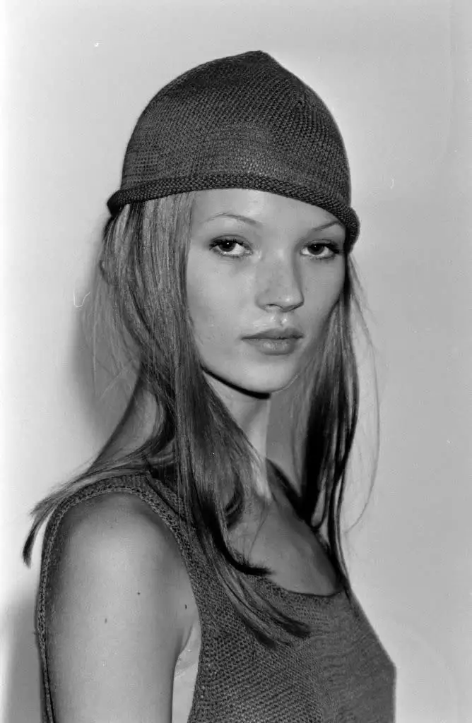 Kate Moss posing in Calvin Klein ready to wear top and hat