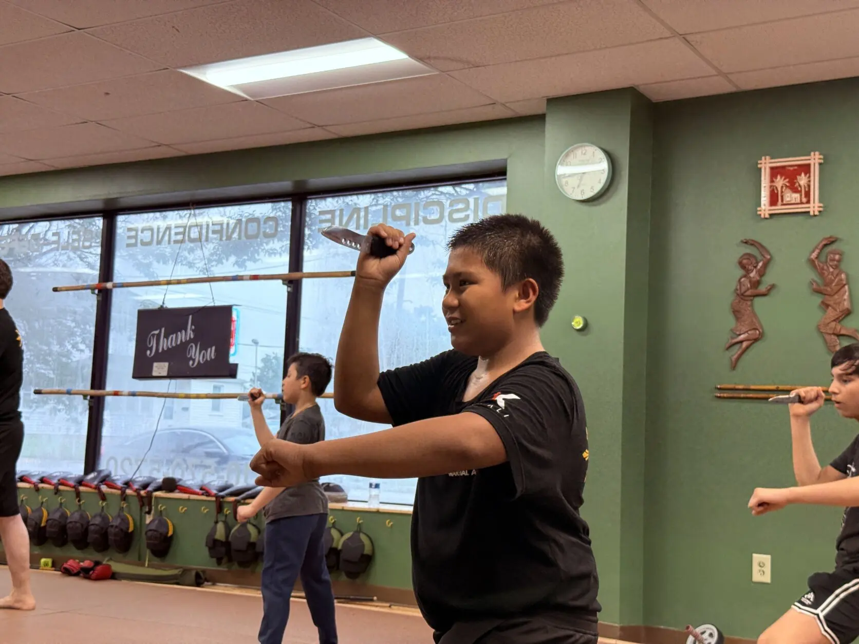 child practicing martial arts