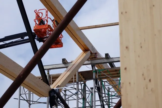 Numerous wooden pieces, including heavy wooden trusses, are seen Thursday, May 29, 2025, at the Upper Macungie Township Community Lifestyle Center. The pieces will ensure the building's longevity. (Oliver Lois Economidis/The Morning Call)